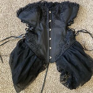 Laced bustiers with metal front attachment clips. Flexible front spine